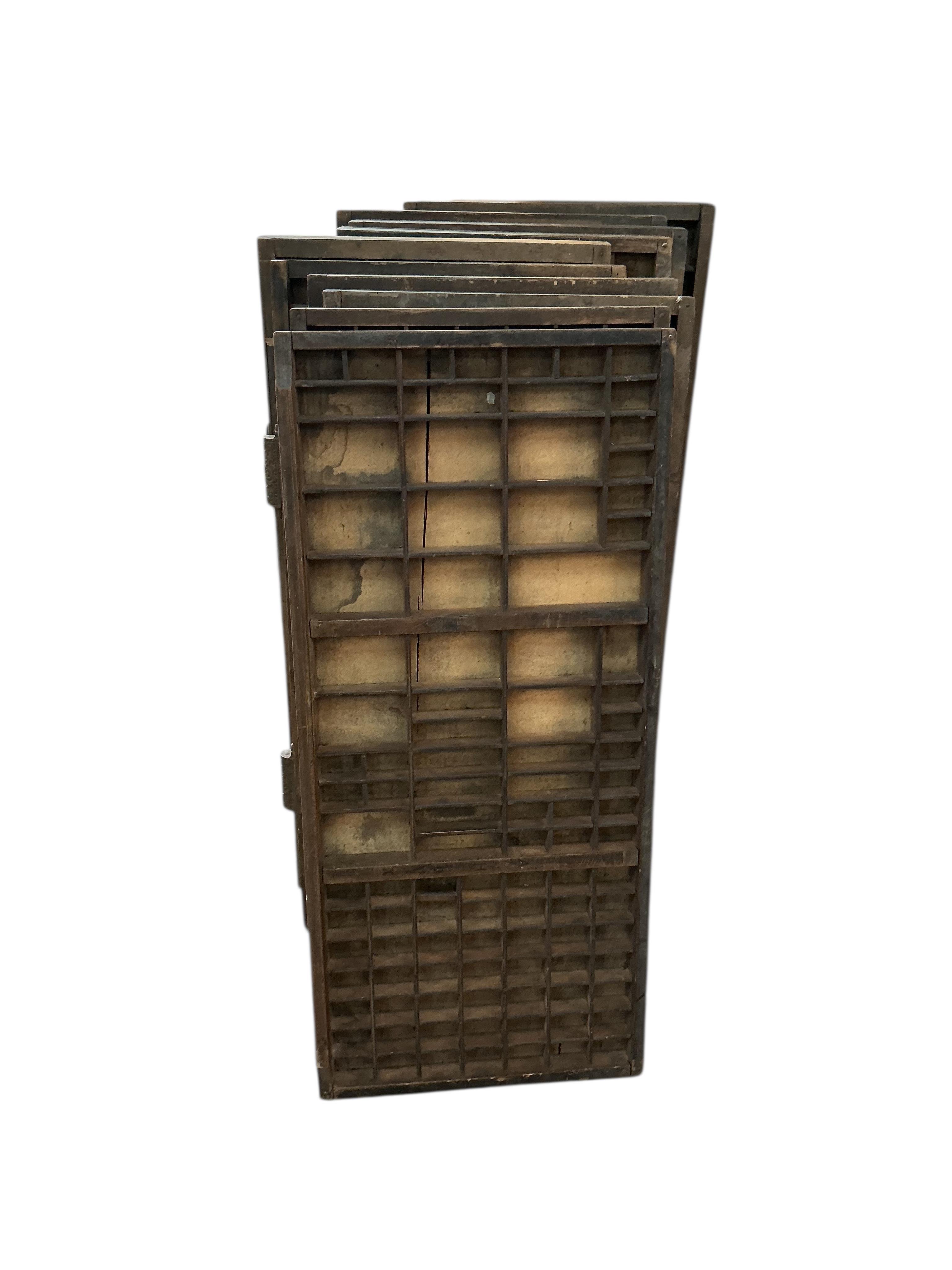 Ten printer's block trays, each width 37cm, height 84cm